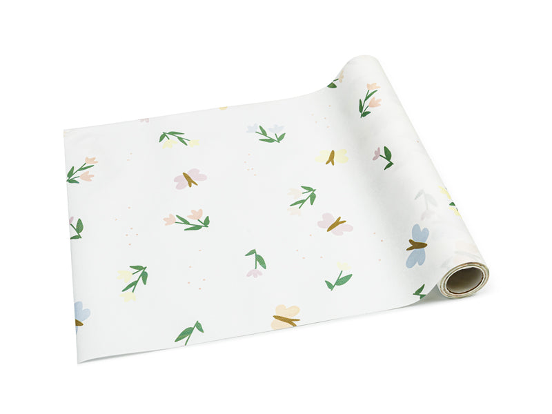 A shimmering table runner featuring enchanting fairytale designs, ideal for themed parties.