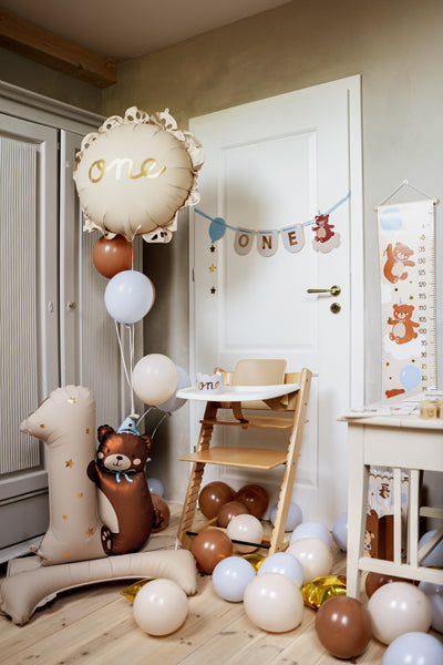 Baby Bear ruffled edge ONE balloon detail showing decorative lace pattern in a styled first birthday setup