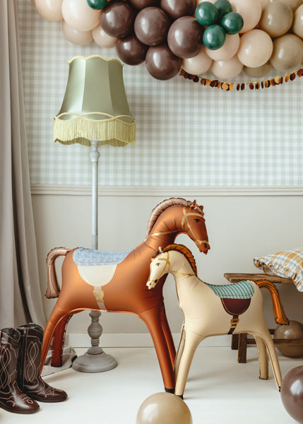 brown and cream horse balloons in party set up