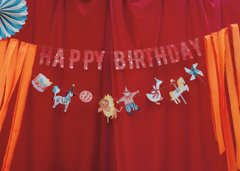Big Top Circus birthday banner detail showing circus tent, animals and tassels