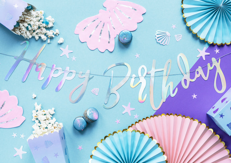 Making Waves iridescent birthday banner detail showing holographic shimmer and ocean colors