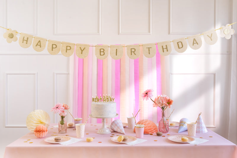 Beige pink felt Happy Birthday banner styled with floral party theme
