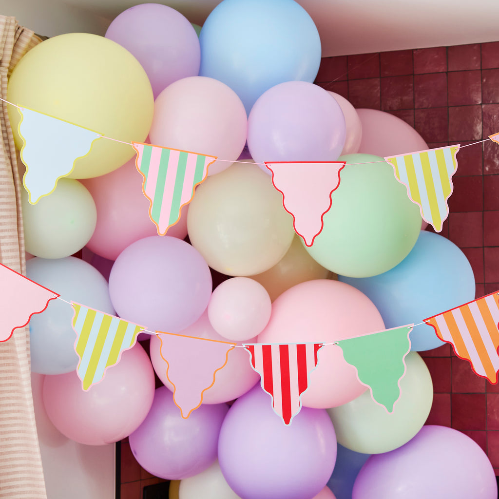 Colour Block Party bunting detail showing striped triangle flags in bright colors