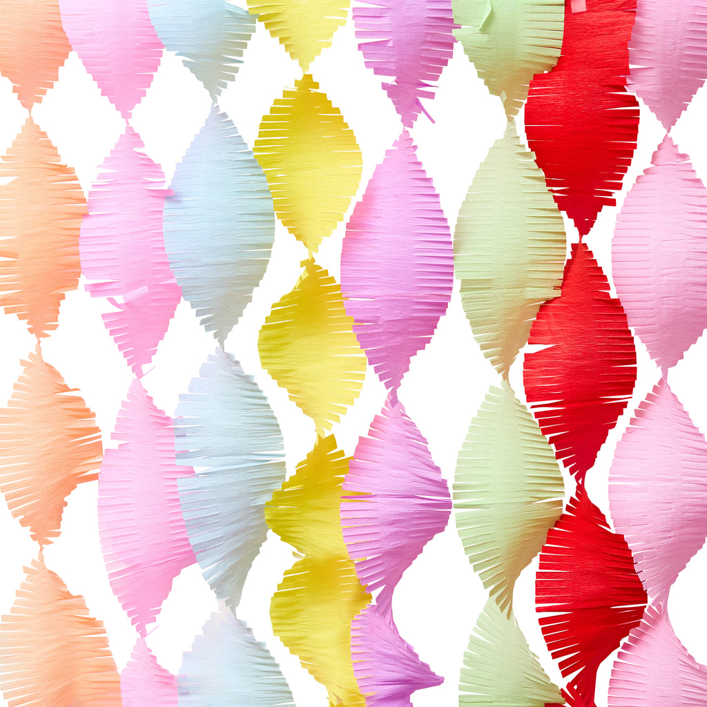 Colorful paper fan pattern crepe streamers on a white background