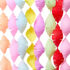 Colorful paper fan pattern crepe streamers on a white background