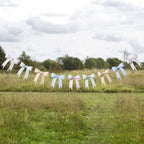 3D bow banner detail showing pink and white bow-shaped decorations on string
