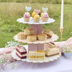 A delicate tiered cake stand featuring floral patterns, perfect for serving treats at a garden tea party.