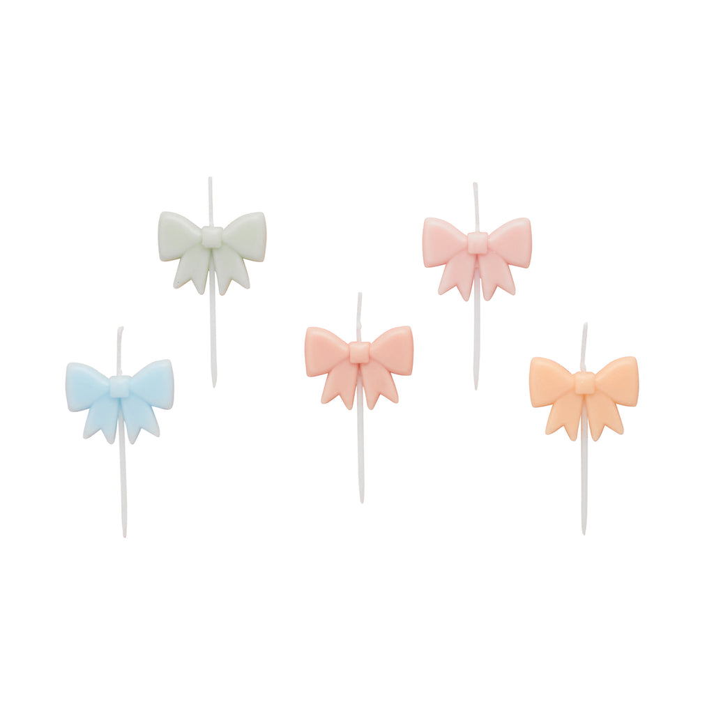 A pack of 5 bow-shaped candles in various pastel colors, perfect for birthday cakes.