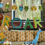 Dino Party ROAR banner detail with dinosaur themed letters and decorations