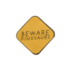 A set of 16 napkins with a "Beware" dinosaur print, perfect for a prehistoric party.