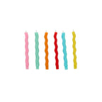 Set of colorful wavy candles on a white background