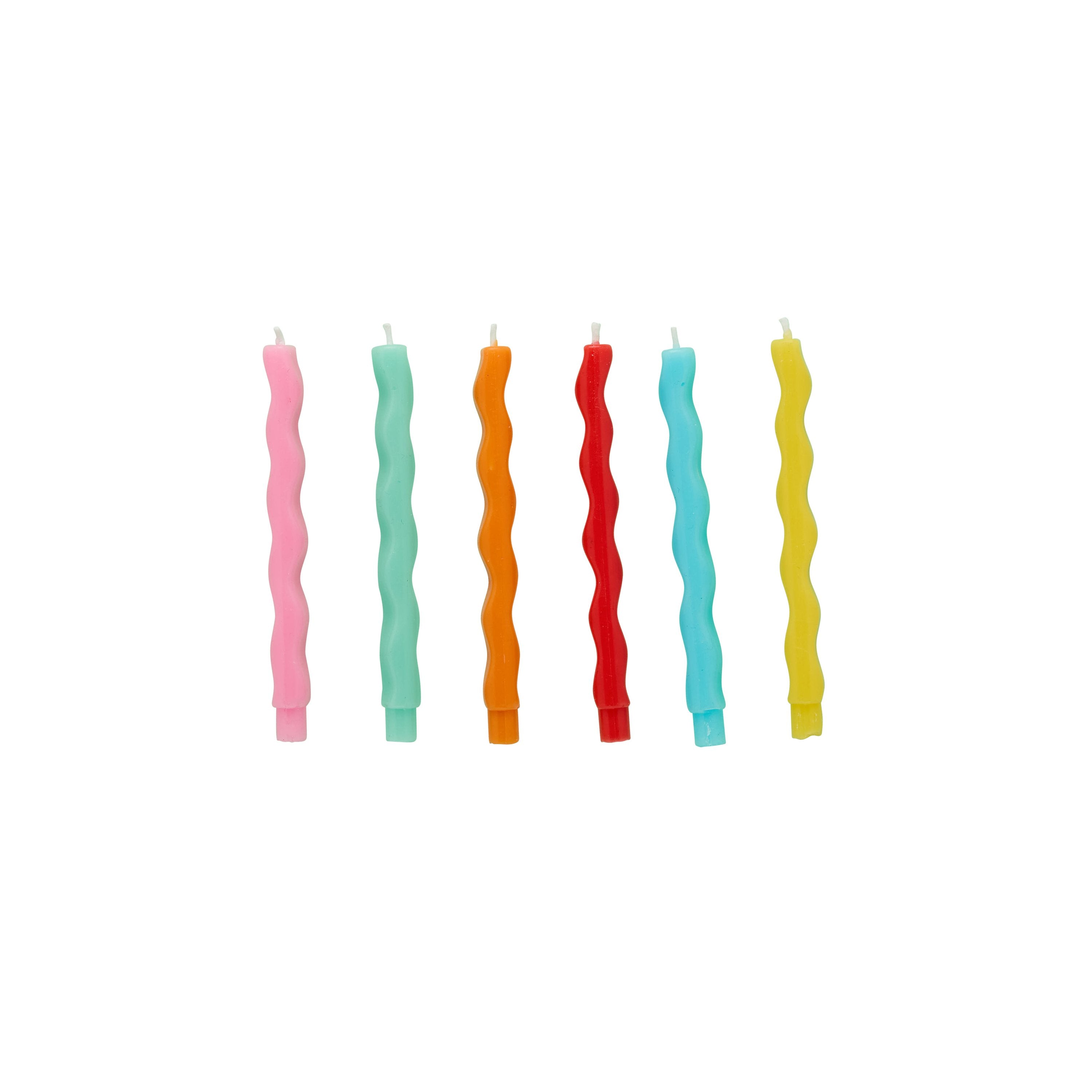 Set of colorful wavy candles on a white background