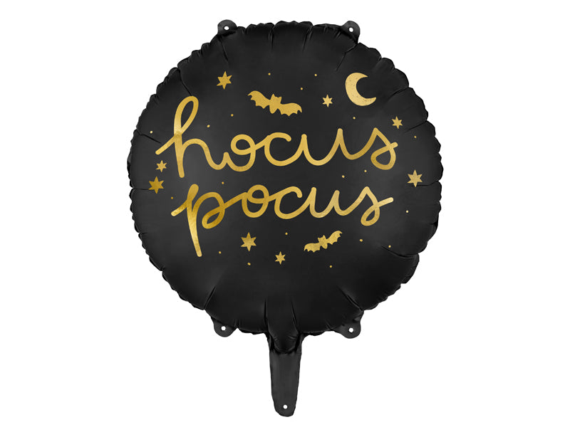Black balloon with gold 'hocus pocus' text and Halloween decorations on a white background