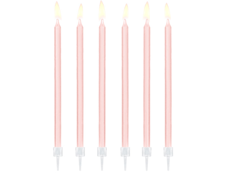 Pink birthday candles on a white background