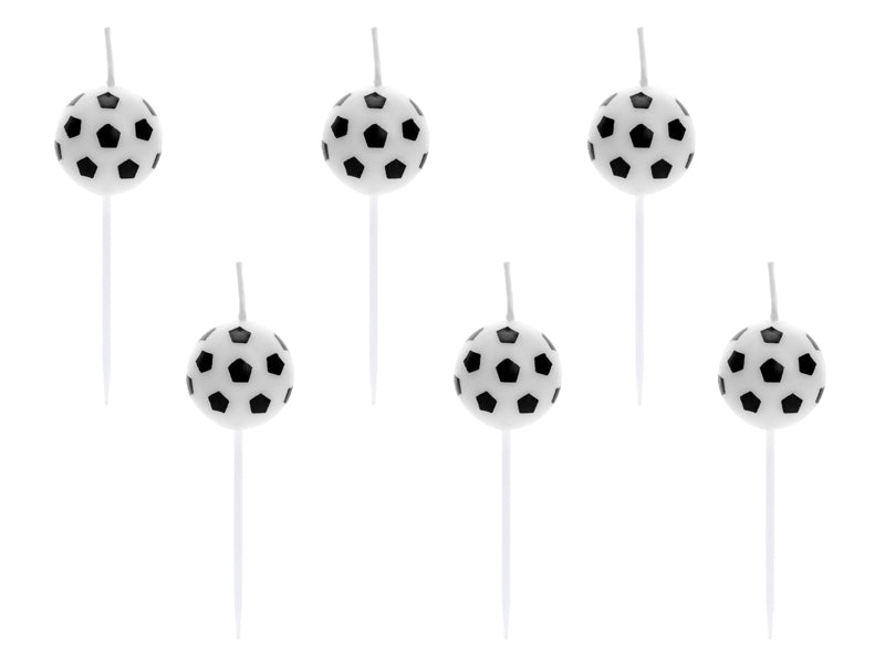 Set of six football-shaped candles on sticks 