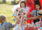 Kids taking food from the snack carousel