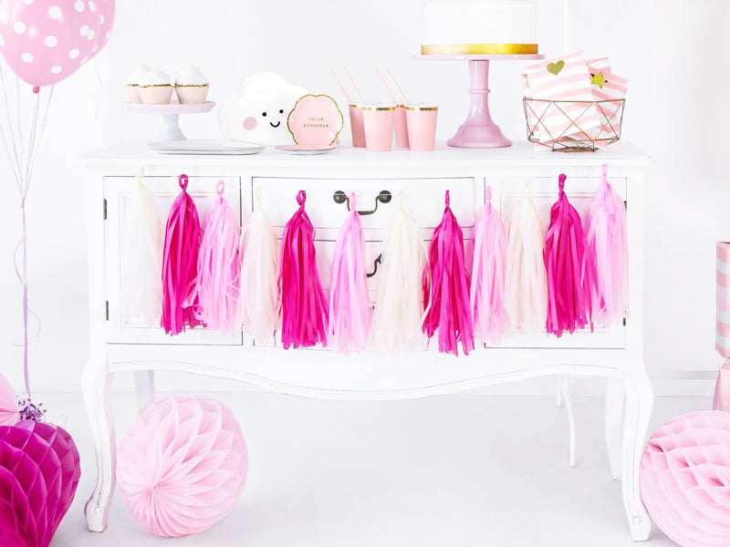 Pink and yellow tassel garland styled with matching party decorations