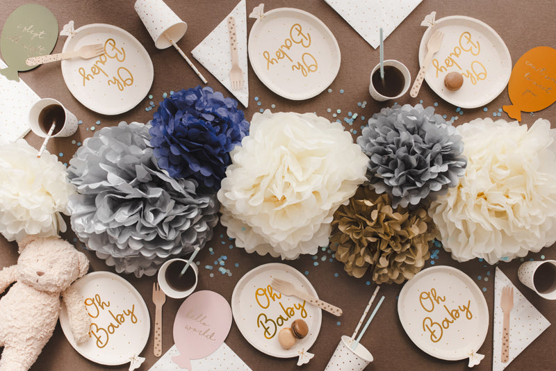 Oh Sweet Baby balloon paper plates styled at baby shower party table photographed from above
