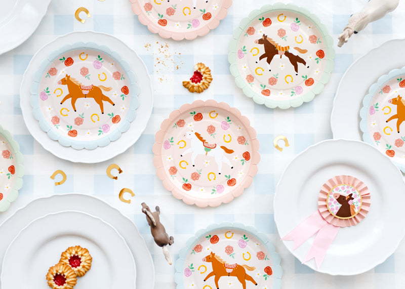 Pink Pony Club paper plates detail showing pink horse illustrations and floral elements